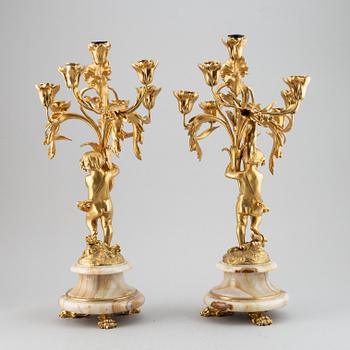 A pair of mid 19th century ormolu and onyx candelabra.