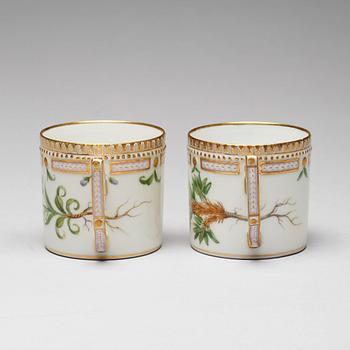 A pair of Royal Copenhagen "Flora Danica" coffee cups with stands, Denmark, 20th Century.