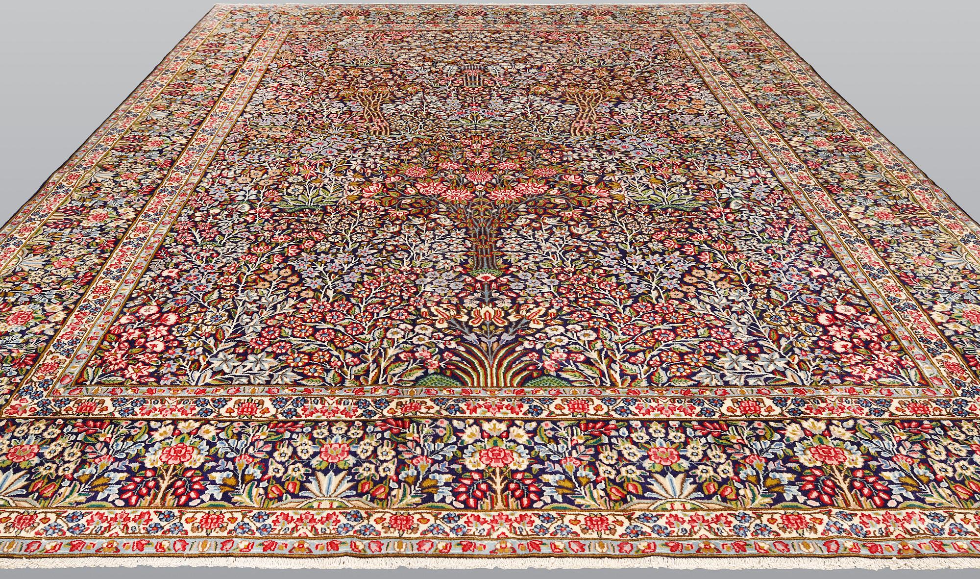 A Kirman Laver carpet, 'Millefleur', approx. 400 x 295 cm.