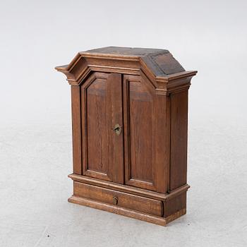 A wall cabinet, 18th century.