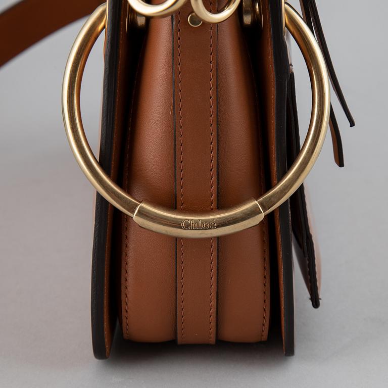 CHLOÉ, a small caramel 'Roy bag'.