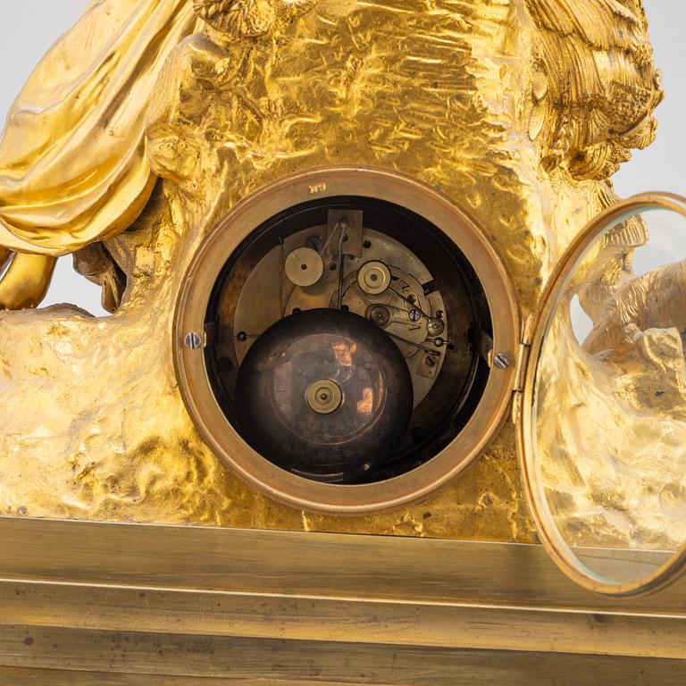 A mid 19th Century brass and gilt brass mantel clock.