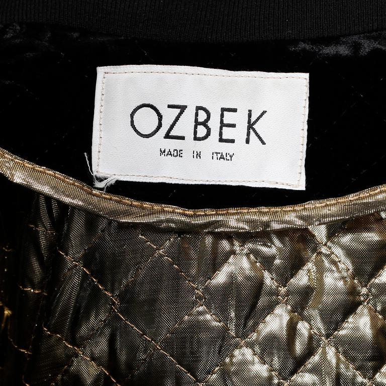OZBEK, a black velvet jacket.