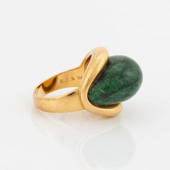 A Georg Jensen & Wendel ring in 18K gold set with a green and black stone.