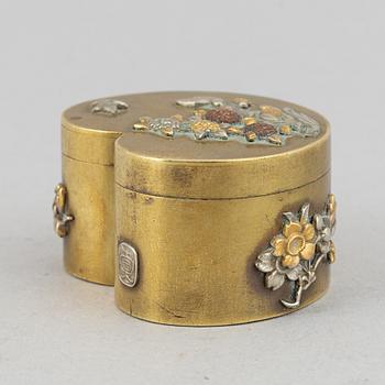 A lidded heart shaped brass box with cover, Meiji period (1868-1912), around the year 1900.