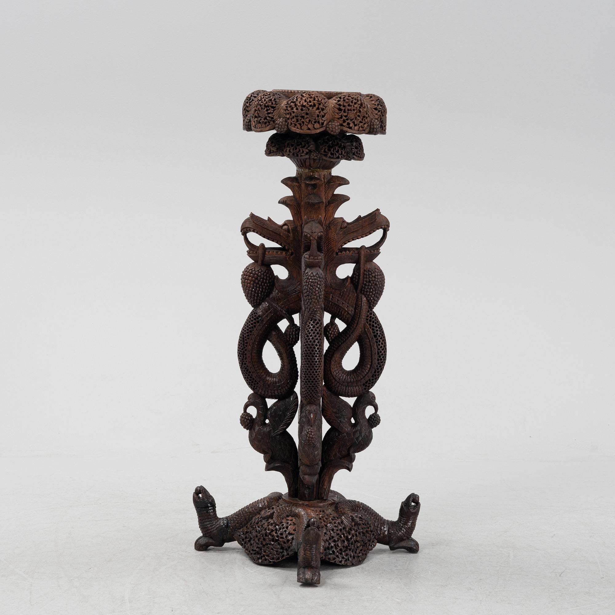 A South East Asian carved wooden piedestal,  20th Century.