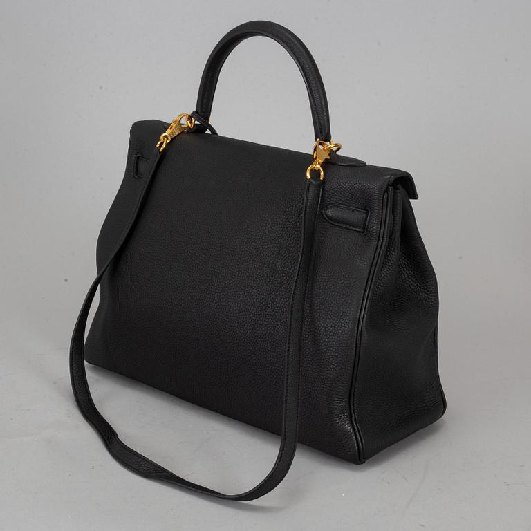 HERMÈS, a 'Kelly 35' black leather bag.