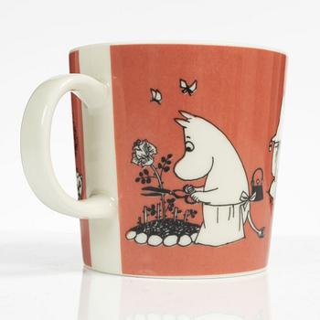 A Moomin mug, 'Dark rosa' with sticker, Arabia, Finland, 1991-99.