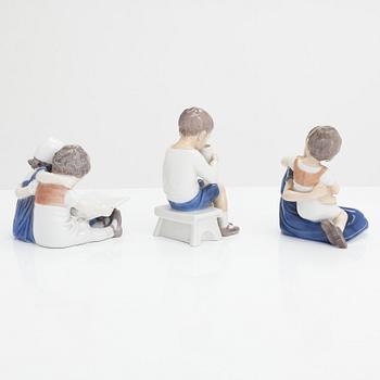 Four Bing & Grondahl figurines and a Royal Copenhagen vase, mid 20th century.