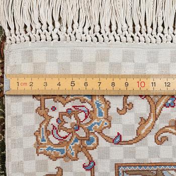 A silk Qum, Central Persia. signed Mohammad Gamshidi, c. 203 x 126 cm.
