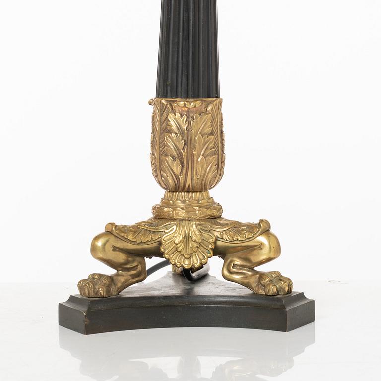 A pair of table lamps/reworked candle sticks, Empire, France, first half of the 20th century.