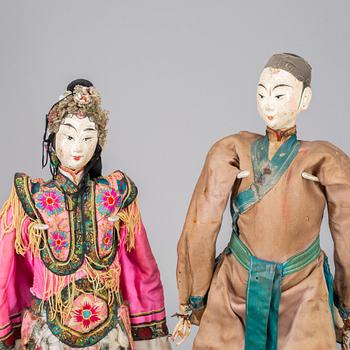 A pair of Chinese dolls, late Qing dynasty.