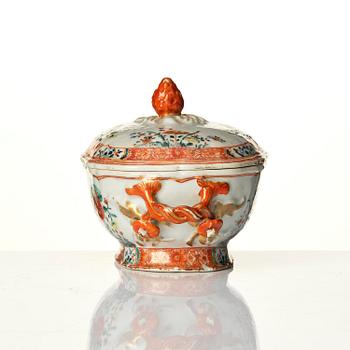 A famille rose butter tureen with cover and stand, Qing dynasty, 18th century.