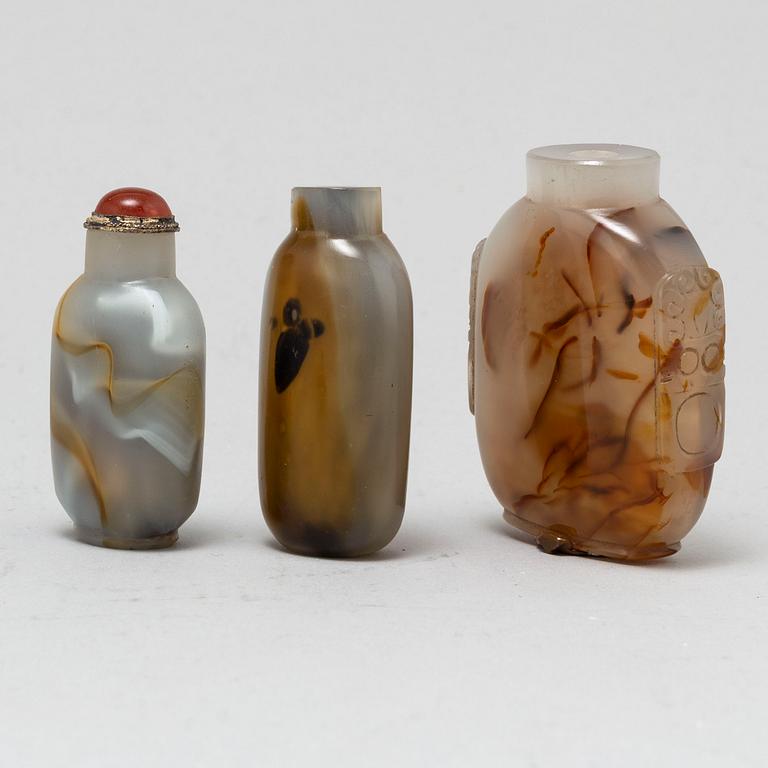 Nine Chinese glass and stone snuff bottles, 20th century.