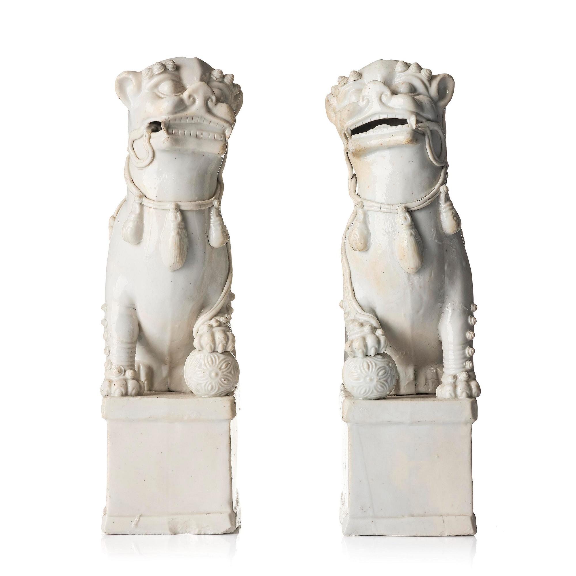 A pair of Chinese blanc de Chine 'Buddhist lion' joss stick holders, Qing dynasty, Kangxi (1662-1722).