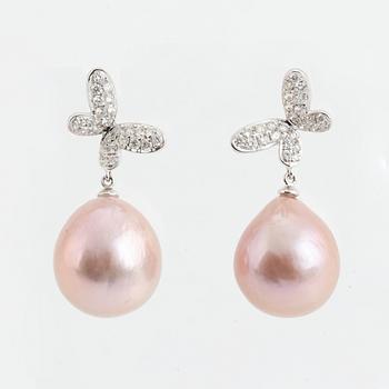 Pink freshwater pearl and brilliant cut diamond butterfly earrings.