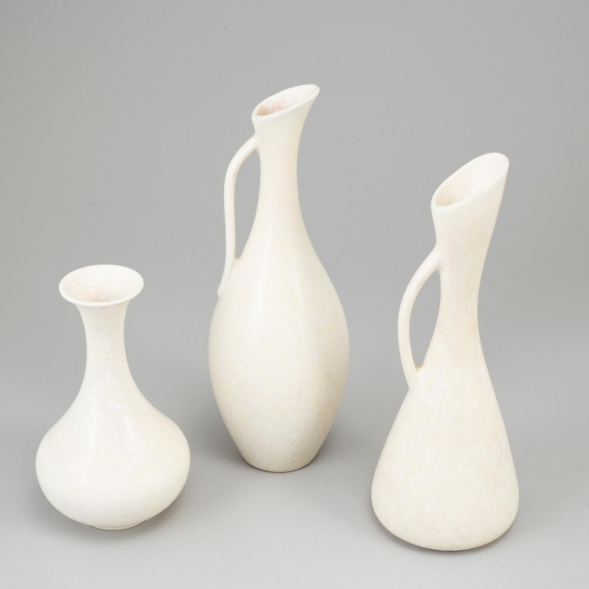 GUNNAR NYLUND, three stoneware vases and two stoneware bowls, Rörstrand, Sweden.