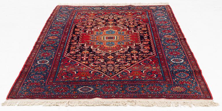 An oriental rug, old, c. 204 x 139 cm.