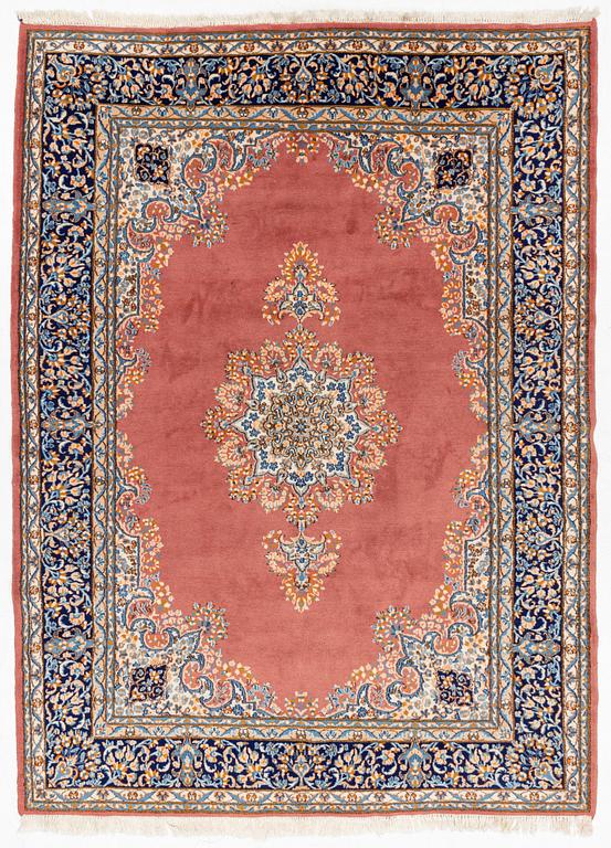 An carpet, possibly a Kerman, c. 310 x 230 cm.