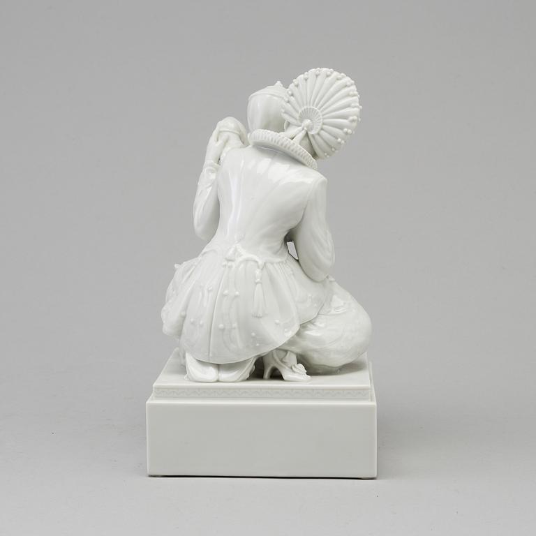 A white glazed Royal Copenhagen porcelain figure, Gerhard Henning, Danmark, 1920's.