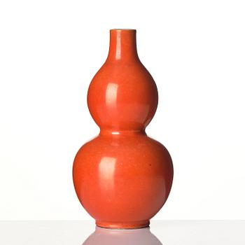 A coral red-enameled double-gourd vase, Qing dynasty with Jiaqing mark (1796-1820).