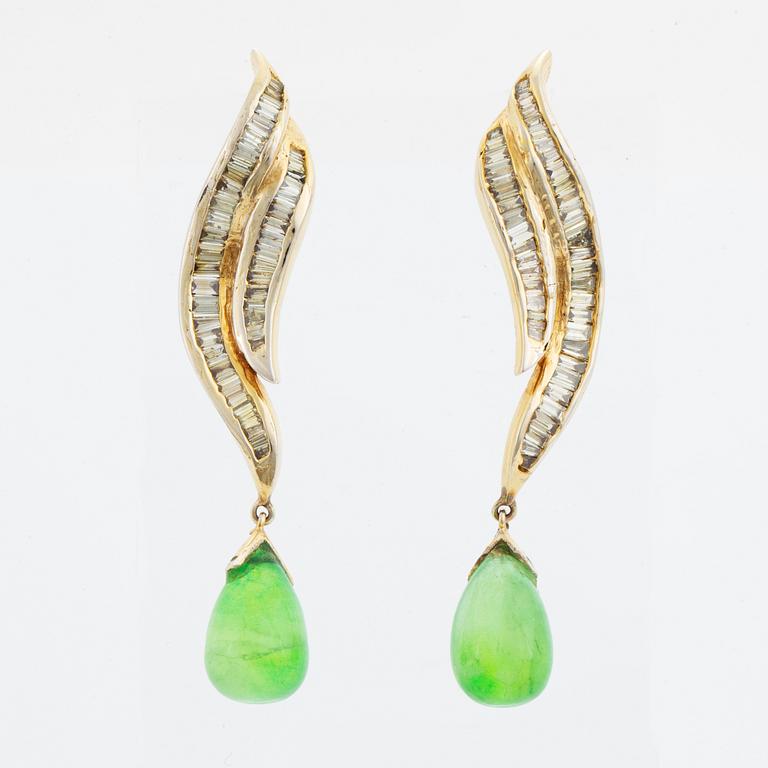 Baguette cut diamond and green stone earrings.