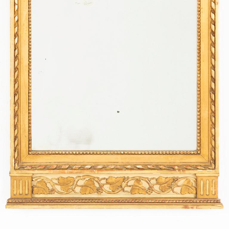 A Gustavian style mirror, circa 1900.