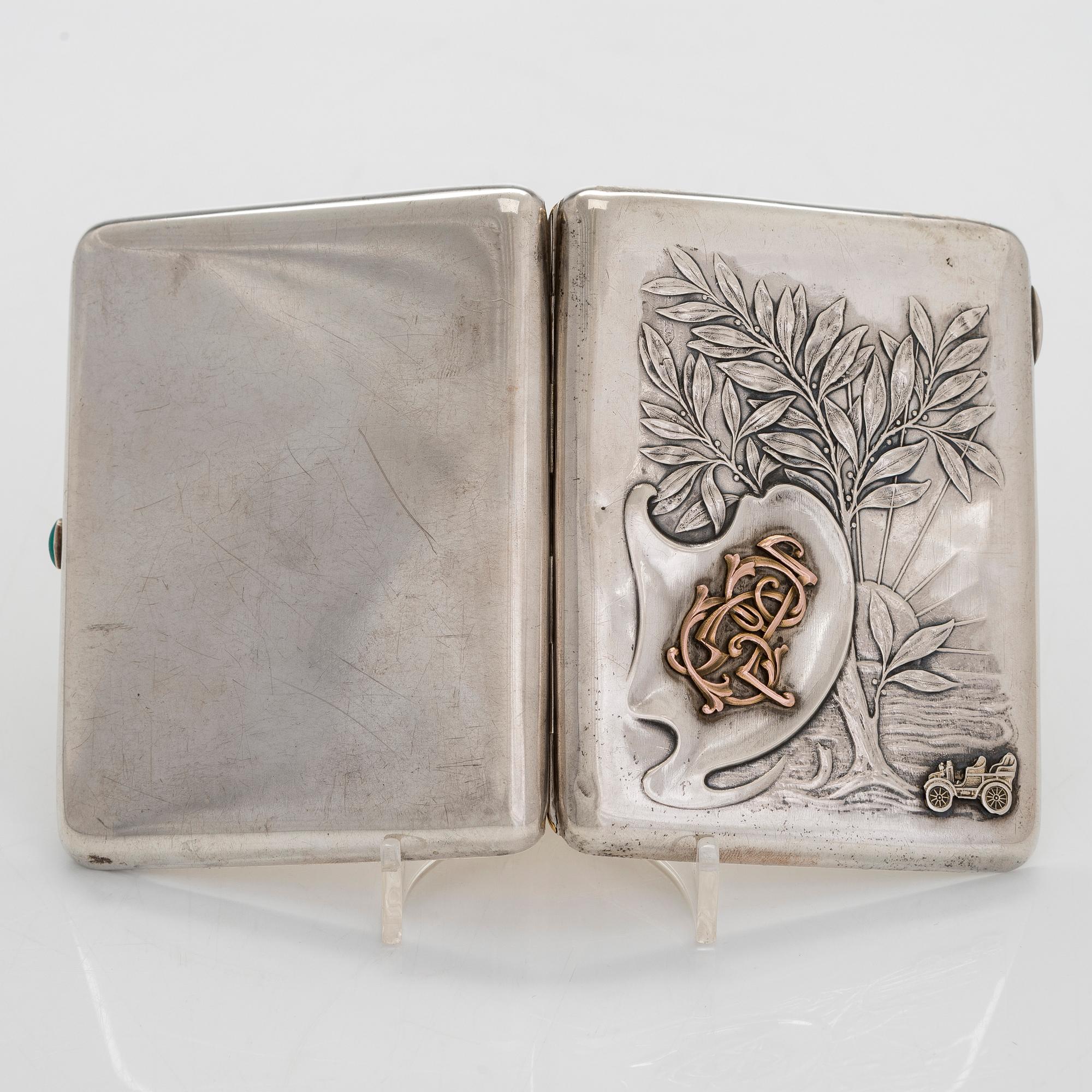 A silver cigarette case, Moscow, dated 1916.