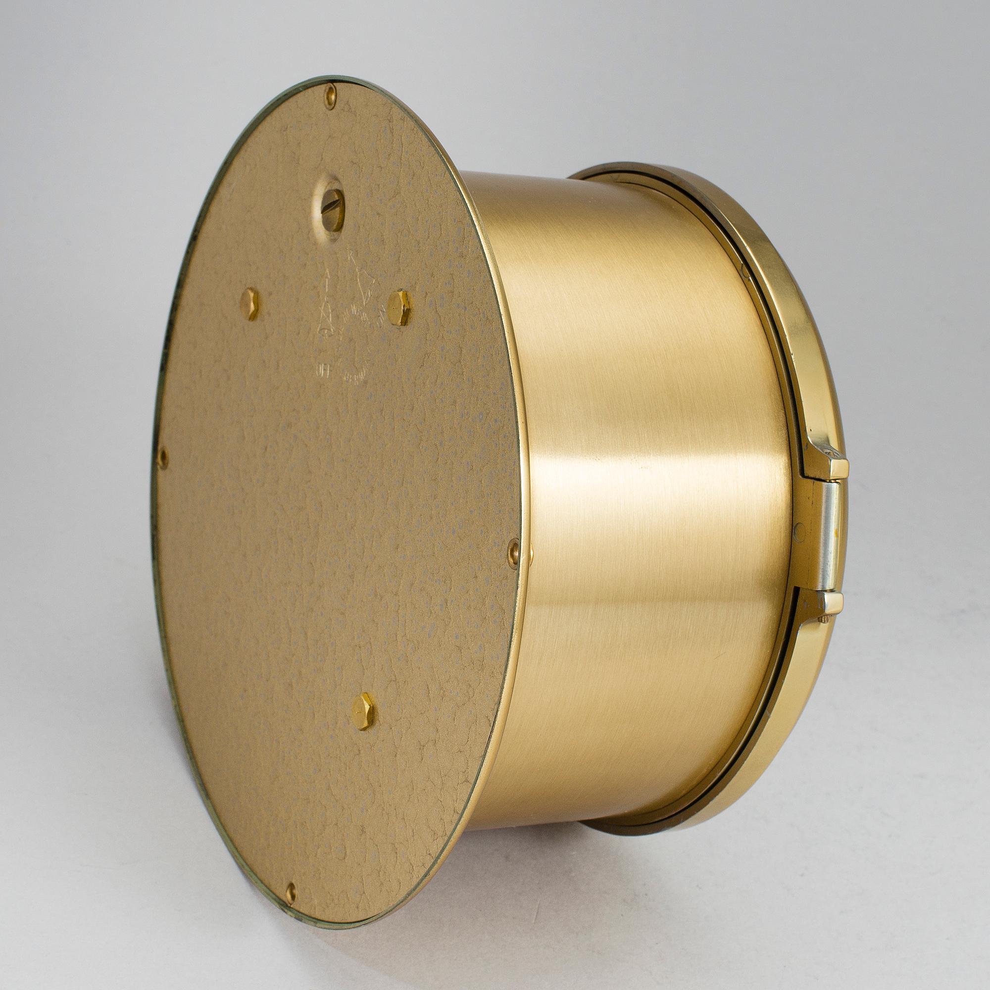 A brass wall clock, Schatz, Royal Mariner, second half of the 20th century.