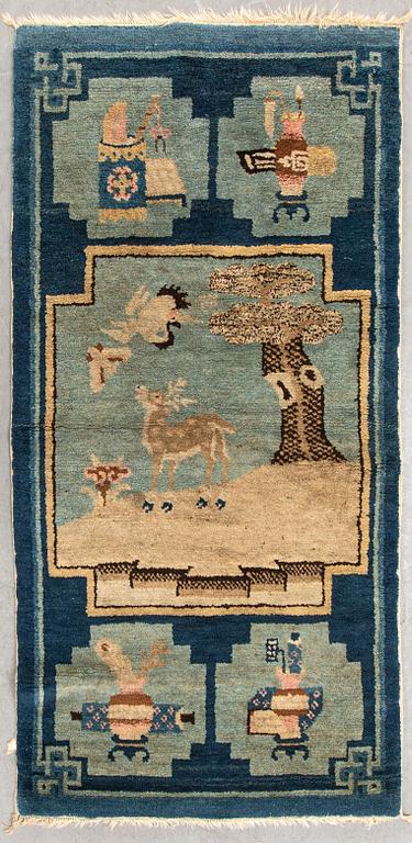 A semaintique Chinese Baotou carpet ca 118x62 cm.