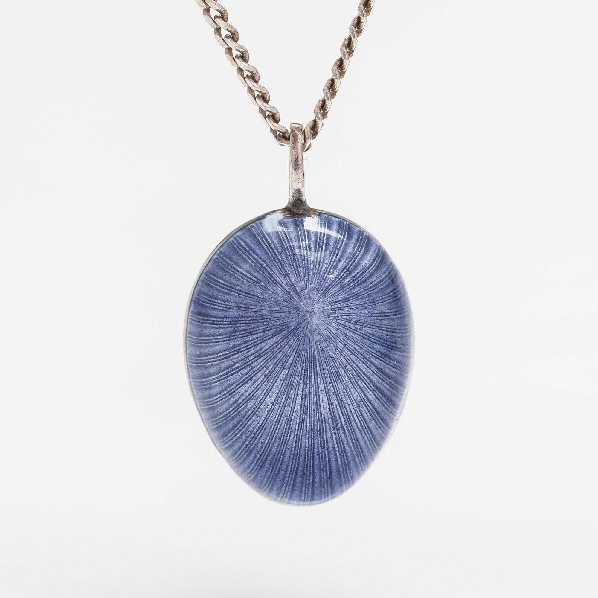 A Tillander, A silver necklace with an enameled egg.