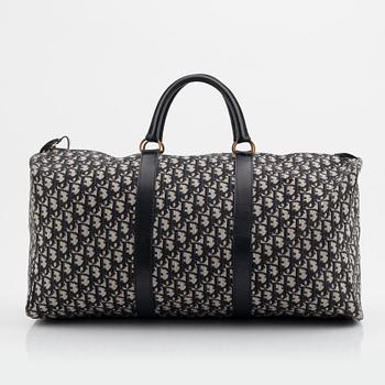 Christian Dior, a canvas weekend bag and umbrella.