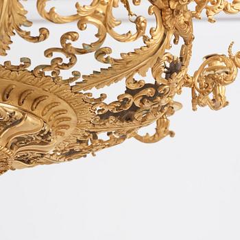 A rococo-revival gilt-brass sixteen-light chandelier, mid 19th century.