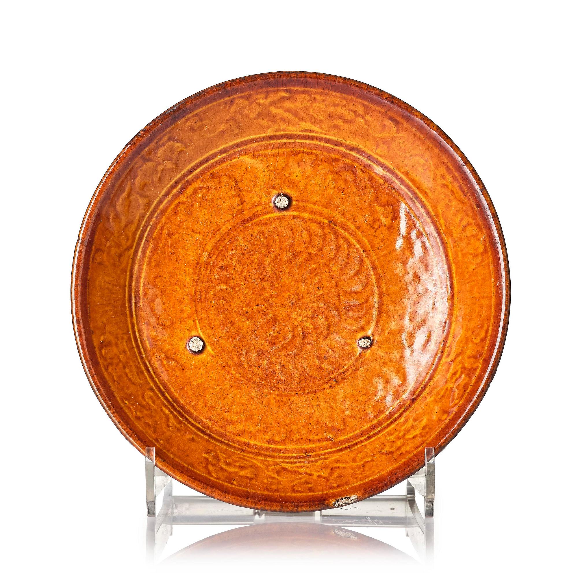 A yellow glazed dish, Liao dynasty (907–1125).