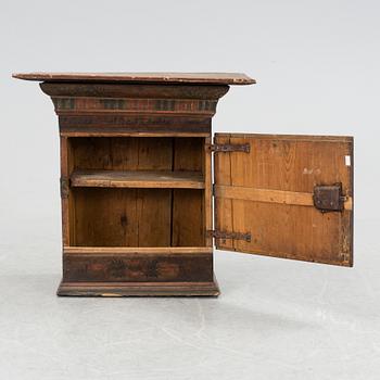 A hanging folk art cabinet from Rättvik Dalarna. Dated 1780.