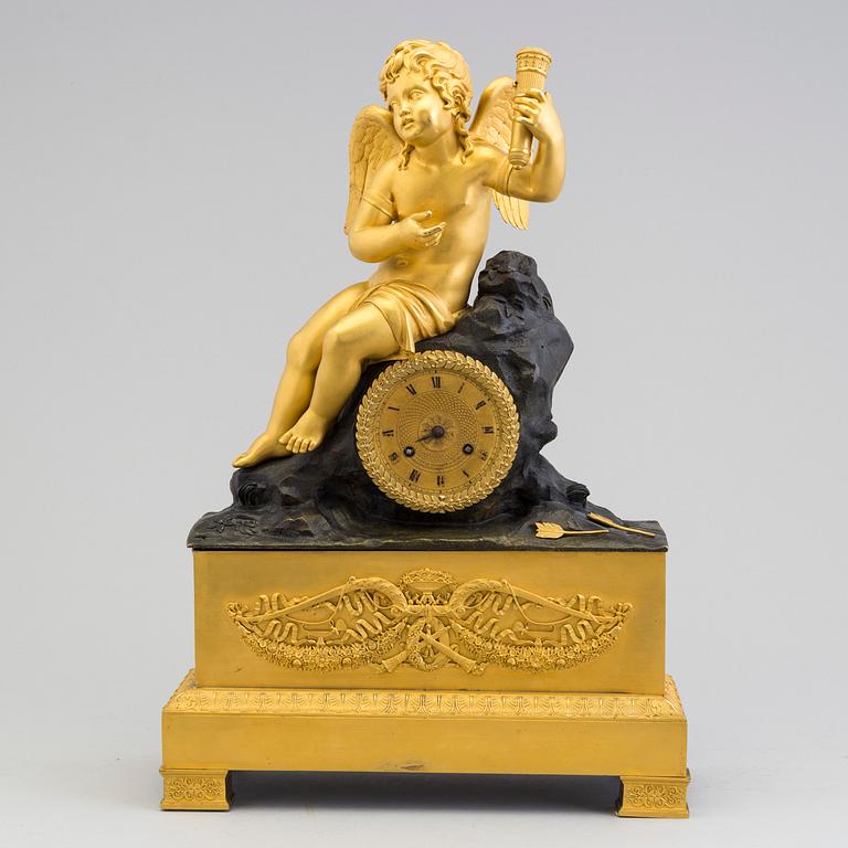 A French Empire bronze mantle clock.