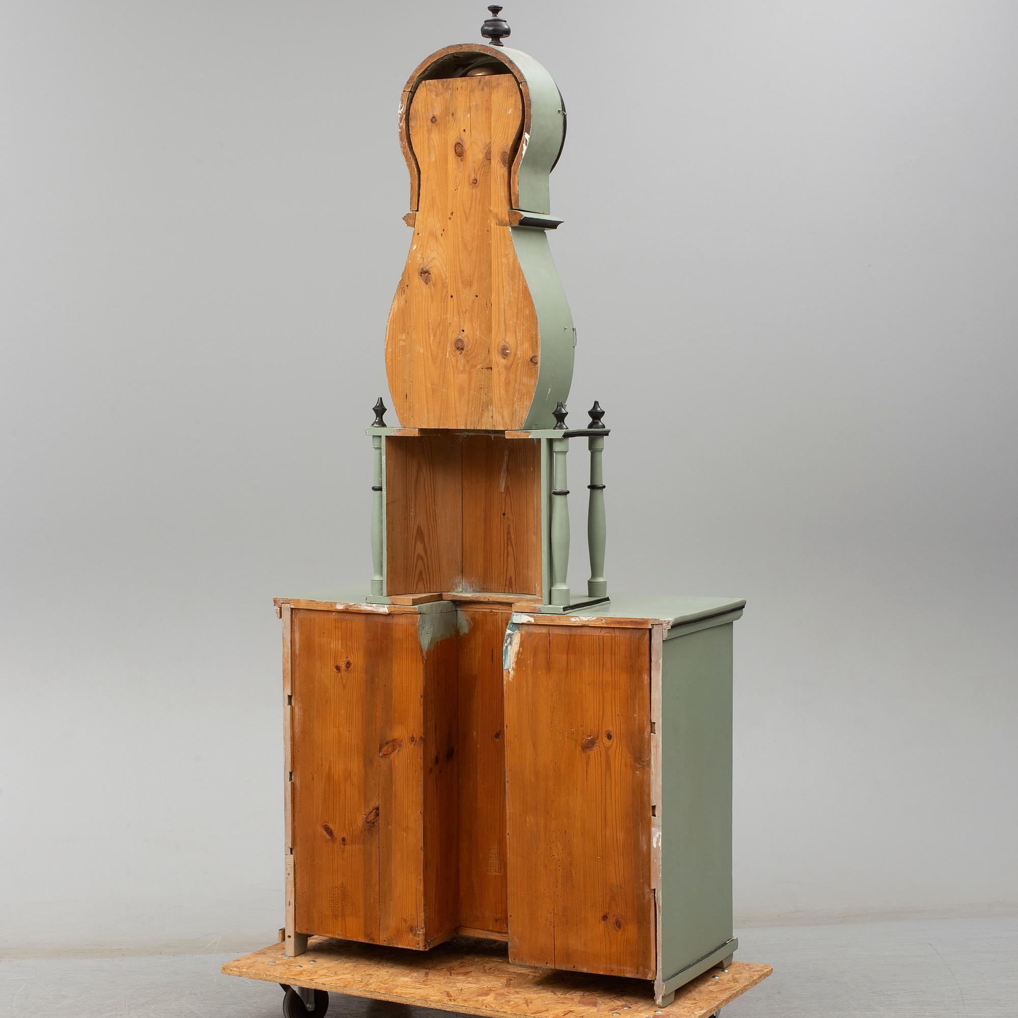 A combined clock and chest of drawers from late 19th  century.