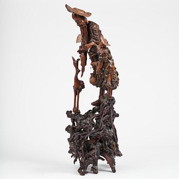 A large well sculptured root sculpture of 'Sholau and attendant', late Qing dynasty, 19th century.
