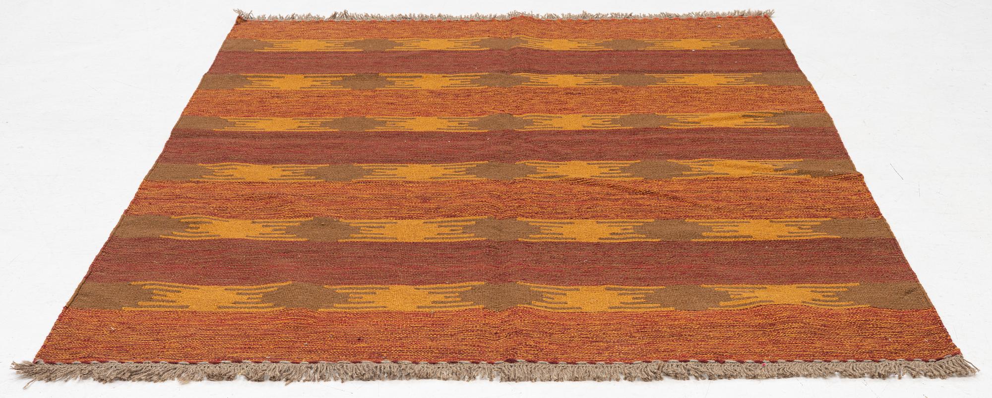 A persian kilim rug, c 196 x 154 cm.
