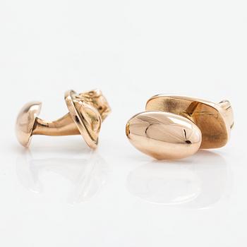 A pair of 14K gold cufflinks.