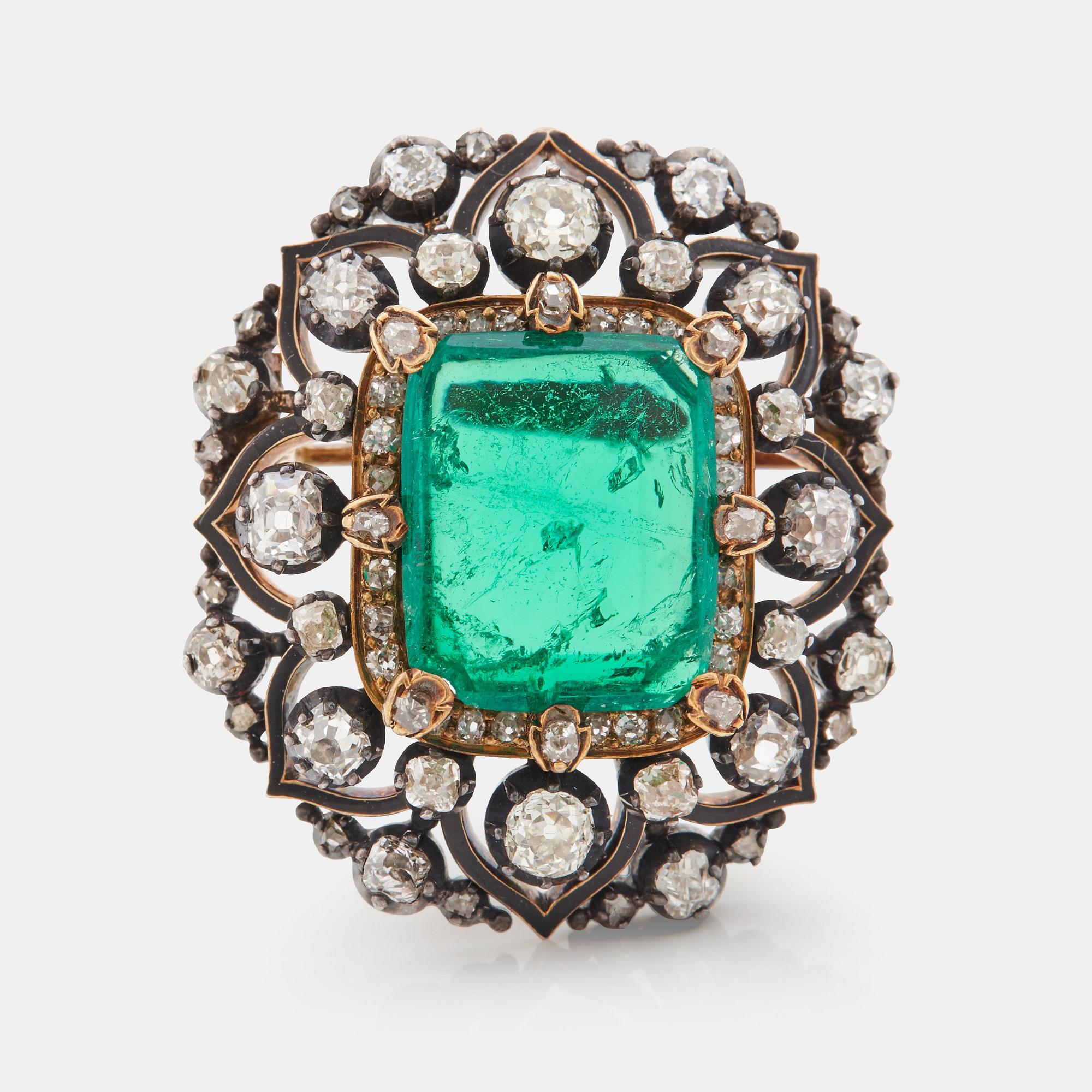 An emerald, black enamel and old cut diamond brooch. 19th century.
