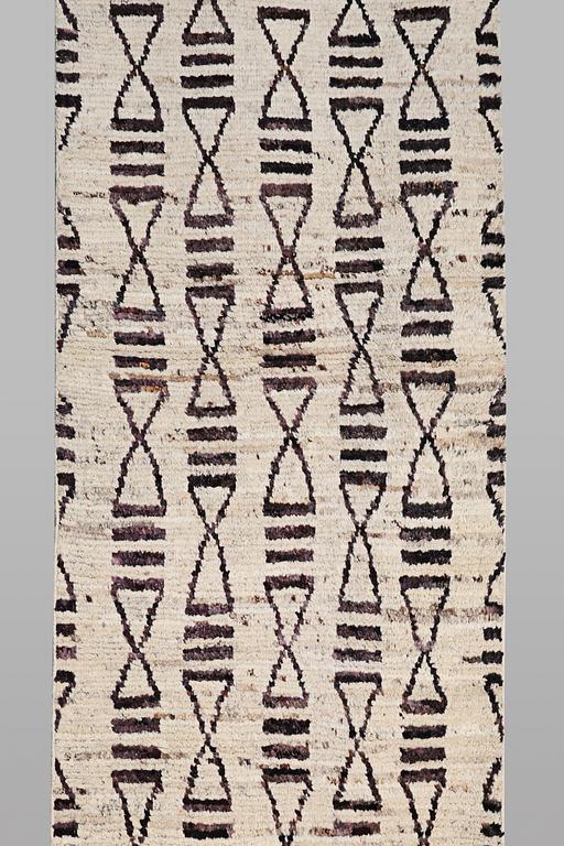 A runner carpet, Morocco, c. 374 x 80 cm.