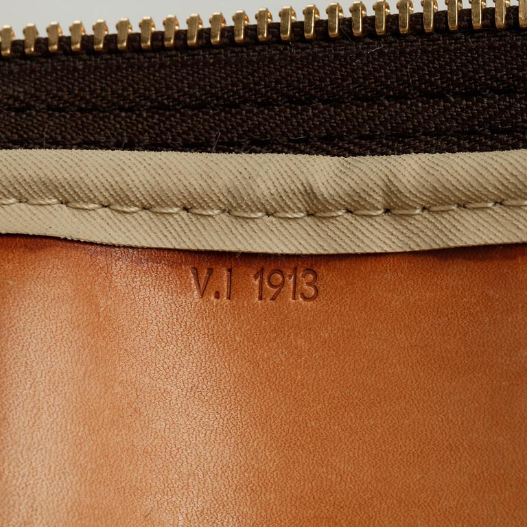 LOUIS VUITTON, a monogram canvas bag / garment cover.