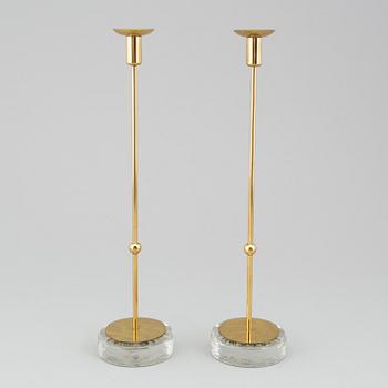 GUNNAR ANDER, A pair of Ystad metall brass candlesticks.