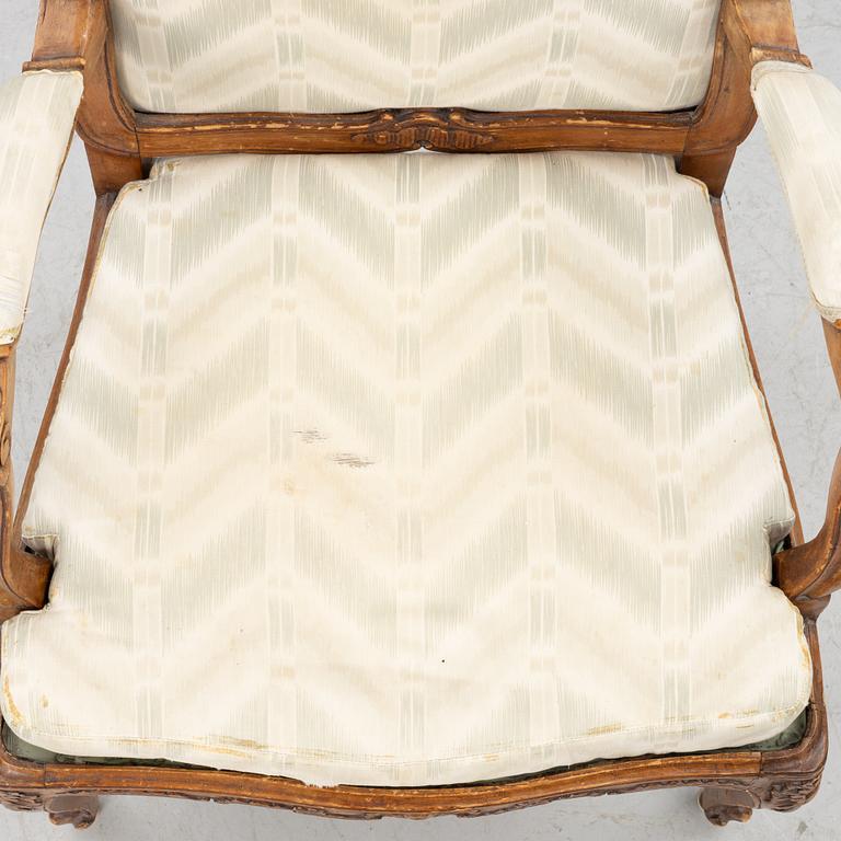 A pair of French Louis XV fauteuils, mid 18th century.