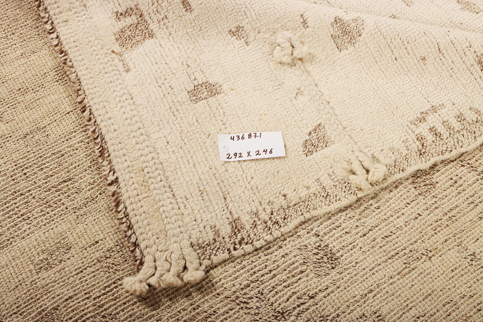 A Moroccan carpet, a. 292 x 246 cm.