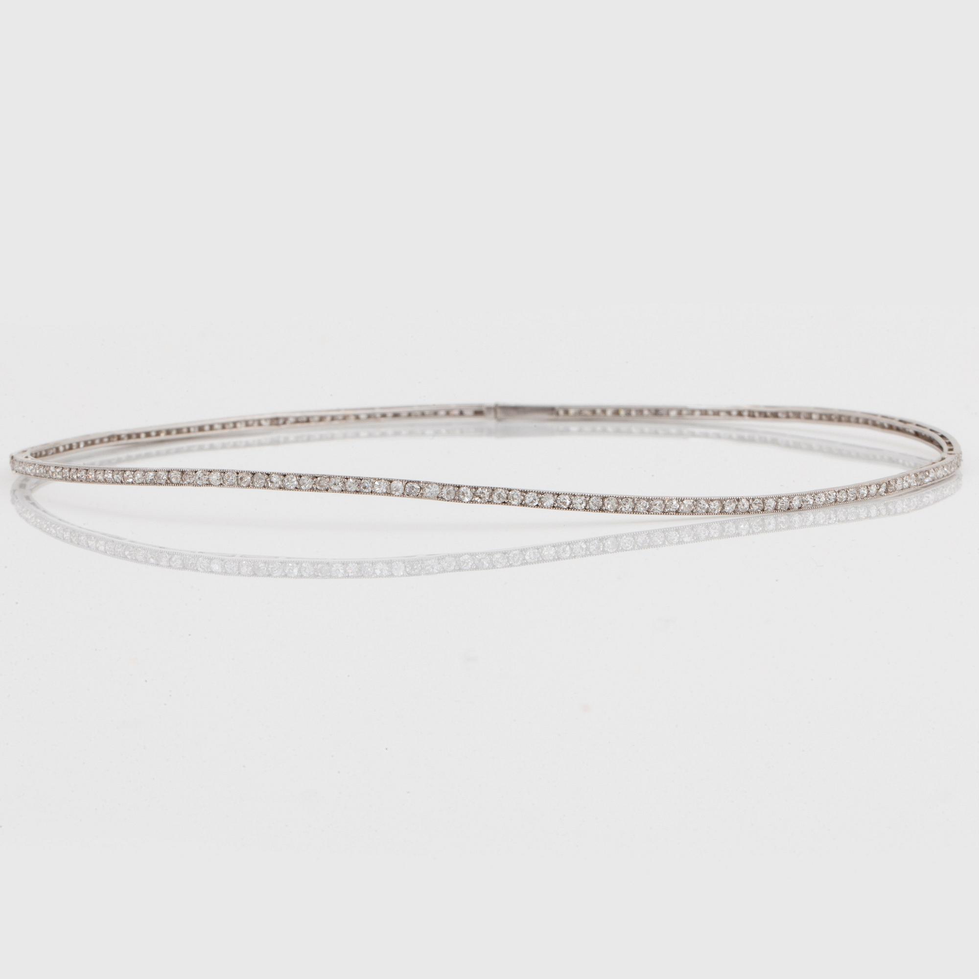 A platinum and 18K gold necklace and pendant.