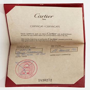 Cartier "Marrakech" an 18K gold bombé ring set with round brilliant-cut diamonds.