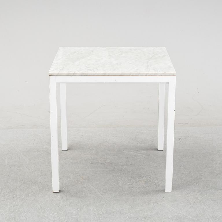 A marble top table, 21th century.