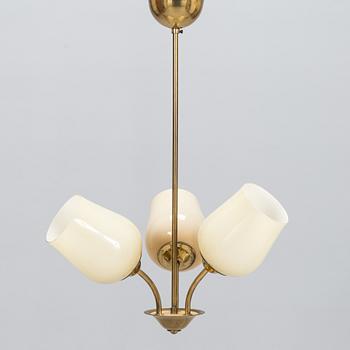 A mid 20th century brass pendant ceiling light, manufactured by Itsu, Finland.